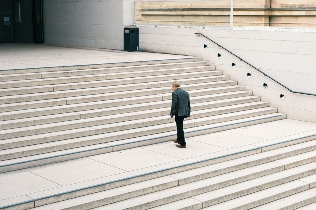 Businessman walking up steps