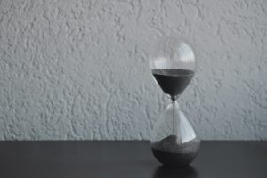 Hourglass with black sand